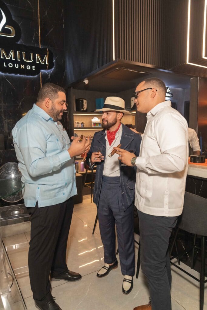 Raudy Jimenez and cigar sommelier Fernando Guerra smoking at Leaf Experiences 2025.