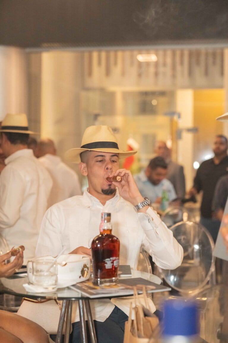 person smoking a premium Dominican cigar paired with Ron Don Isidro Gran Reserva rum