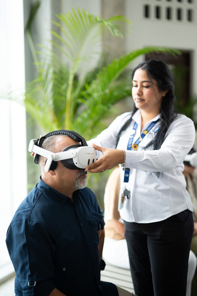Visitor using a virtual reality headset during the immersive experience on Santiago and tobacco