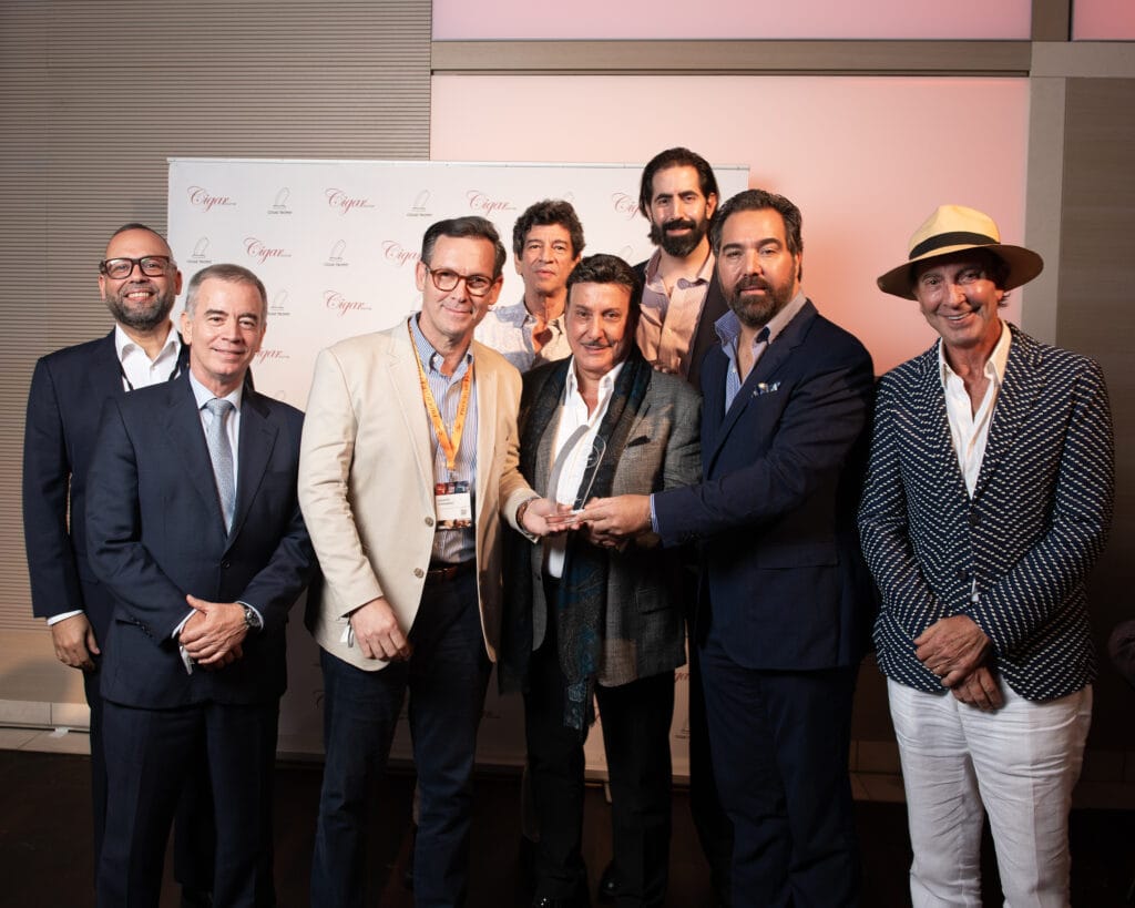 Ciro Cascella and Agustín Fernández accepting the 2026 Charity & Community Award from Cigar Journal at Intertabac in Dortmund.